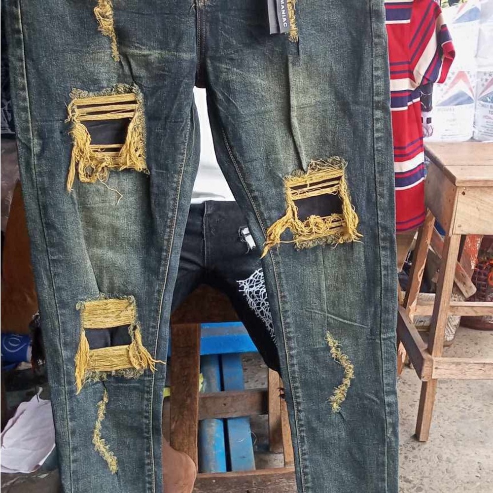 Green Skinny Jeans with Bold Distressed Accents